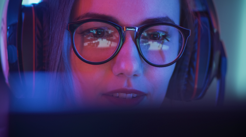 Woman wearing glasses looking at a screen